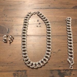 Silver 3 piece chain necklace, bracelet, and earrings.